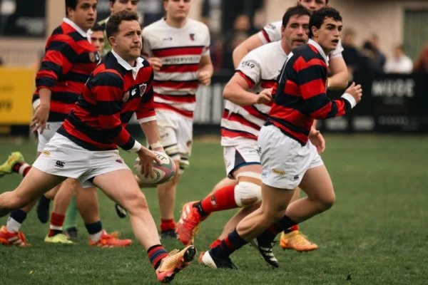 rugby player running with ball